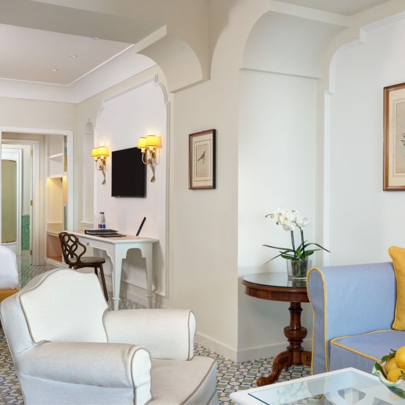 Suite view from the balcony detail of the sofa and the bed day time